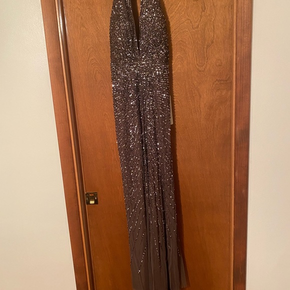 Adrianna Papell Halterneck
Fully Beaded Gown. - Picture 8 of 9